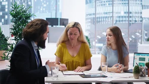 Woman Signs Documents in Modern Office