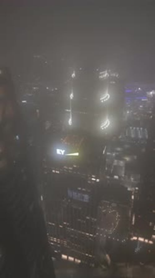 Aerial video of Los Angeles skyline at night in fog, California, USA