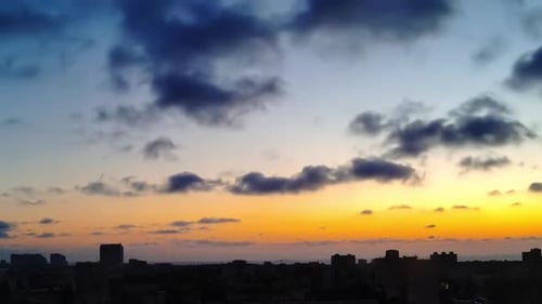 Dawn and Clouds Quickly Run over the City