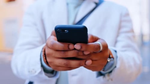 Phone, hands and typing in city for social media, texting or web scrolling outdoors in street