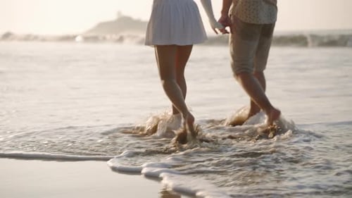 People's Feet Going Barefoot on Wet Sand in Sea Surf on Tropical Island Reflection of Nice Couple