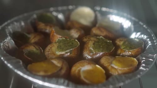 Closeup Plate with Baked Escargot Indoors