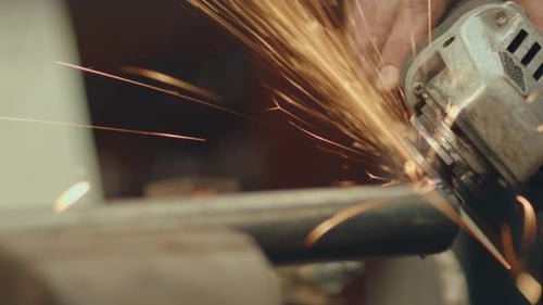 Close Up of Industrial Worker Using Angle Grinder