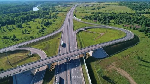 Transport Interchange on the Highway Aerial of Cars Drive Along the Highway Outside the City
