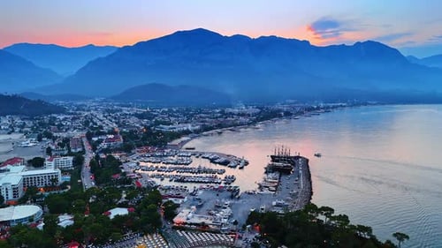Dusk time in beautiful resort Fethiye, Turkey. Numerous yachts are at the berths.