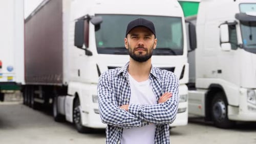 Young Truck Driver is with His Vehicle at Daytime