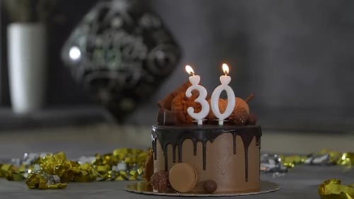 Delicious Chocolate Cake with Candles Celebrating Thirty Years