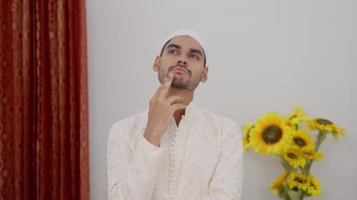 Young Man Thinking and Pondering Indoors
