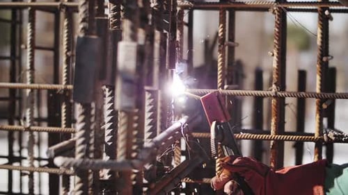 Construction Worker Welding Metal with Protective Gear