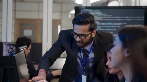 Group of programmers are coding at office.