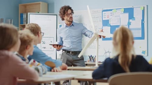 Elementary School Physics Teacher Uses Interactive Digital Tablet to Show to a Classroom of Smart C