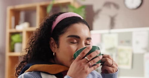 Tea, drinking or happy woman in apartment to relax in lounge for cup of hot chocolate