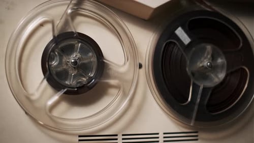 Vintage Reel-to-Reel Tape Recorder Playing Music
