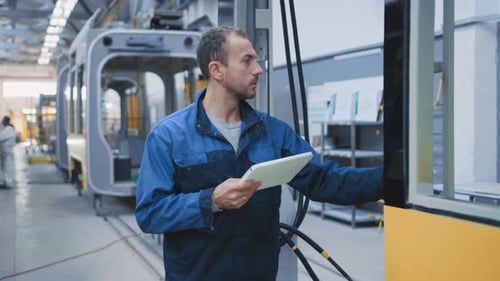 Railway Engineer Young Caucasian Technologist Learning Building Plan Browsing Tablet Constructing