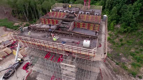 Builders Construct Transport Bridge at Building Site
