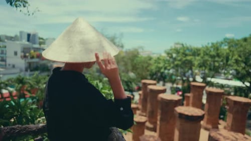 Female Tourist in Conical Hat Admiring Beautiful Park in Asian City in Summer Weekend Trip and