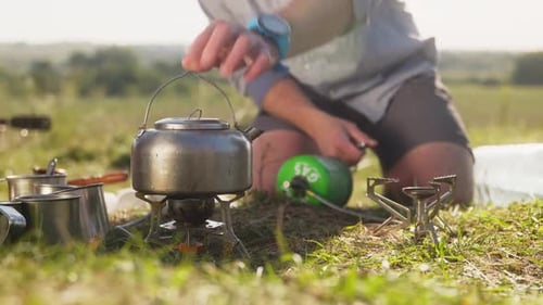 Setting Up Camp Stove for Outdoor Cooking