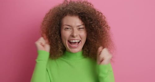 Emotive Joyful Woman Celebrates Victory
