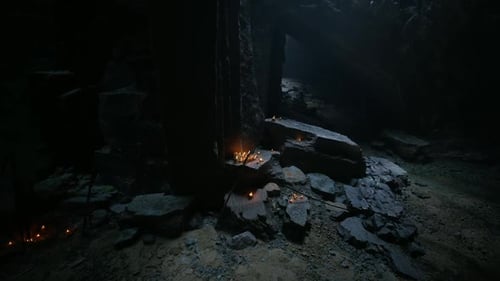 Dark Cave Background with Flickering Fires