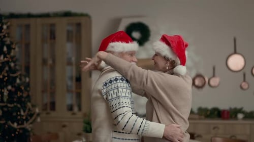 Senior Couple Sharing Christmas Dance at Home