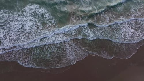 Ocean Movement Near Beach Waves Forming White Foam Sea Waves in Constant Motion Powerful Waves