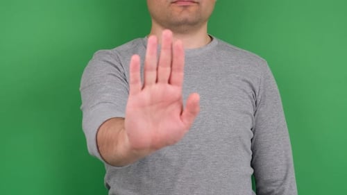 Hand Making Stop Gesture on Green Screen