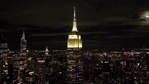 Aerial view of illuminated skyline at night, United States.