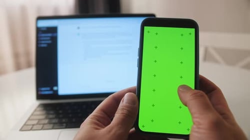 Phone with Chroma Key Green Screen with Man Working with Chatbot AI Online Connecting with AI and
