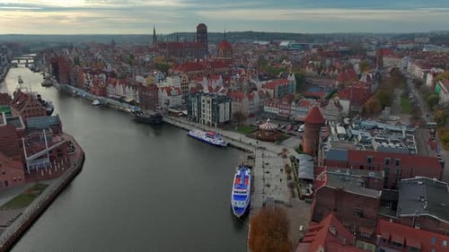 Aerial view of drone flying forward to the old town of Gdansk, Poland above the Motlawa river