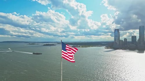 American Flag Waving in Front of New York City
