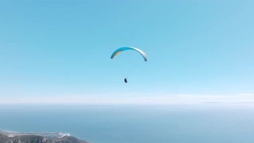 Man with Instructor Flies with Paraglide Slow Motion Up in Air Scenic Aerial