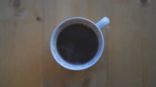 Hot Coffee in White Cup From Birds Eye View