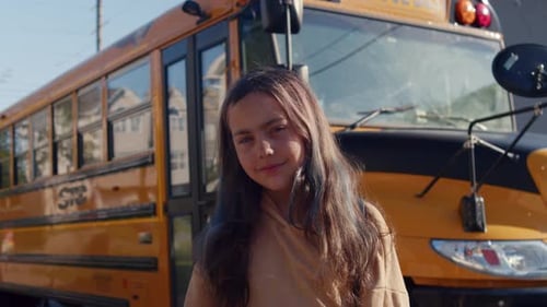 Back To School Girl Standing Near Yellow Bus With Backpack Ready