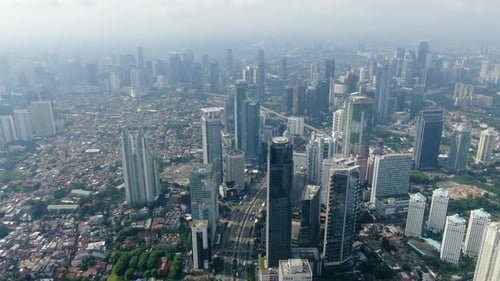 Skyscrapers of Jakarta financial district, Indonesia. Aerial forward