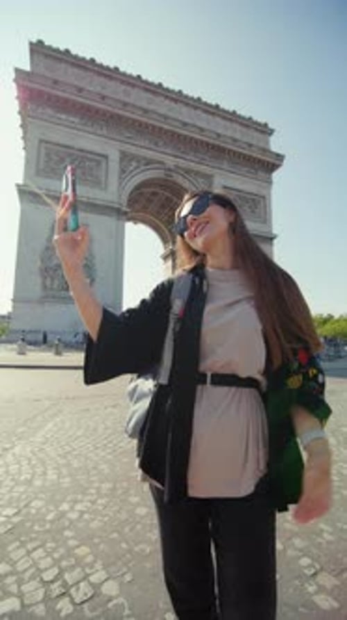 Beautiful Woman Taking a Photo Near the Arc De Triomphe in Paris