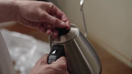 Silver Electric Kettle Preparation in Home Setting