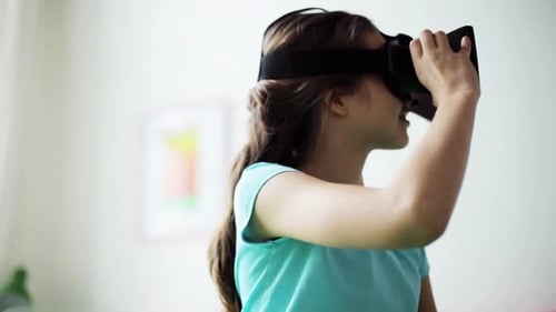 Teenage Girl Using a Virtual Reality Headset Indoors