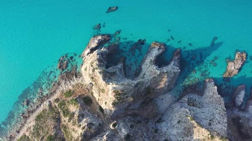 Aerial 4k drone video of crystal clear sea and coastline, Italy