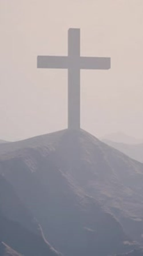 Cross on a Foggy Peak