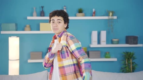 Enthusiastic Young Adult Dancing with Joyful Energy Indoors