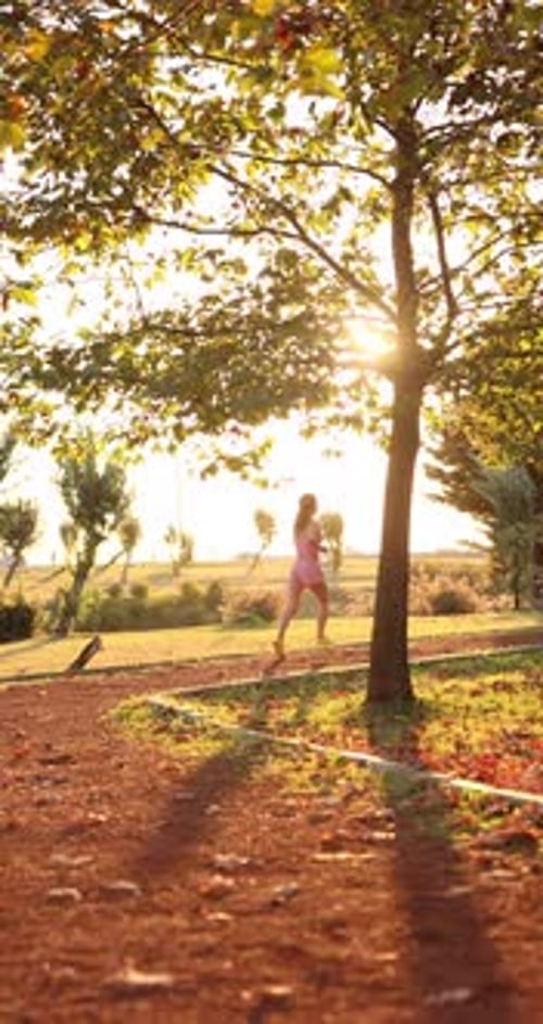 Happy young woman outdoors in autumn park