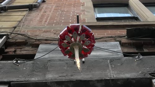 Geometric Sculpture on Brick Building Exterior
