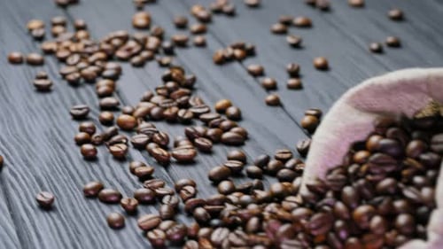 Roasted Coffee Beans Spilling from Sack
