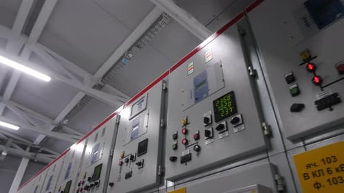 Row of Switchboards with Buttons and Screens at Substation
