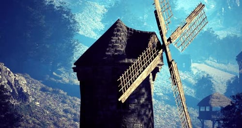 Old Windmill Stands Tall Amidst a Serene Landscape at Dawn