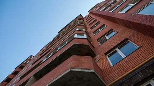 View From Below at Red Apartment Building