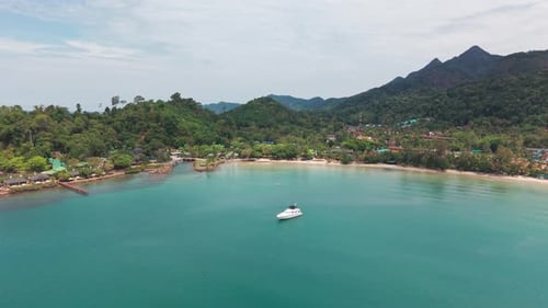 White Yacht Floating Near Tropical Island Coastline