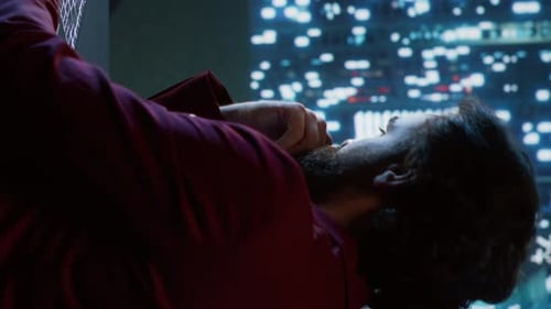 Adult Analyzing Data on Futuristic Computer Screen