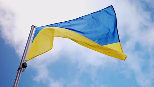 Flag Waving Against Blue Sky