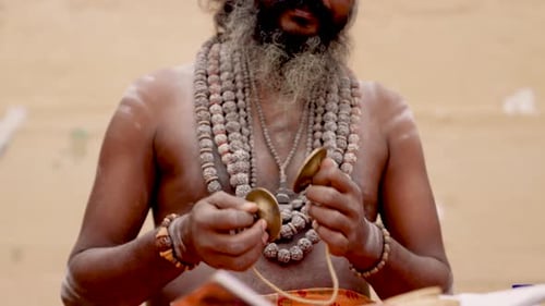 Indian Priest Playing Clash Cymbals